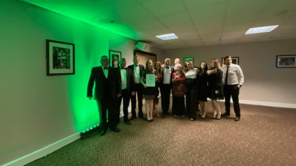 Image show the team from dasco construction with their award from the wigan business awards