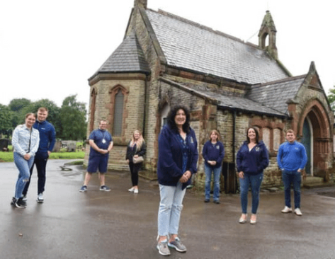 Image shows Andrea Tyrer and Adam Prince, left, whose daughter Emmie is buried at the cemetery, with Danny McGarvey from CRISP Communities CIC, Sam Broxton from Thrive CIC, Friends of Hindley Cemetery chairman Julie Bennett, secretary Kerry Garforth and treasurer Lyndsey Williams, with Scott Rothwell from Dasco Construction standing outside of Hindley Cemetery Chapel