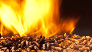 Wood pellets and fire to represent a biomass boiler for effective waste management