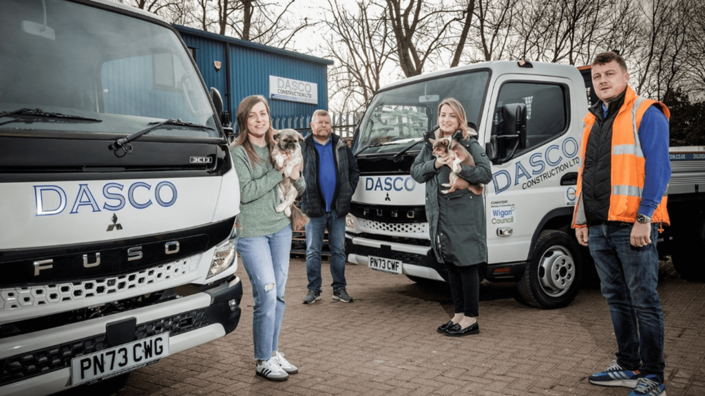Dasco Construction's Charlotte, David, Collette and Scott with two of their new FUSO Canters, and guard dogs Roxy and Ralph! 