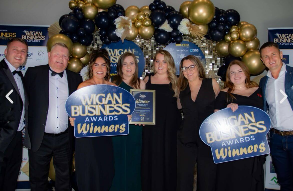 The team from DASCO Construction smiling at the camera