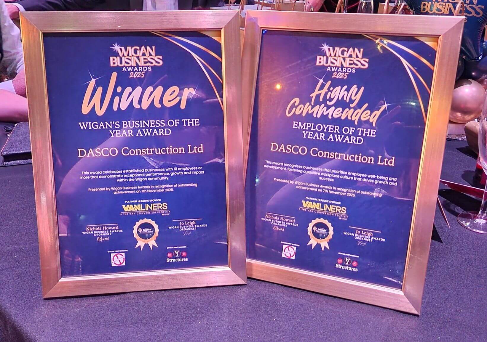 Two winners certificates in gold frames