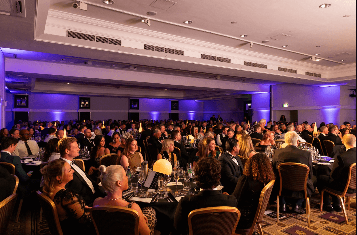 Lots of people attending an awards ceremony