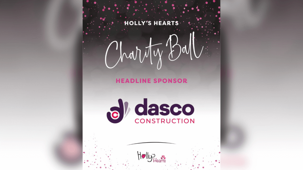 Promotional graphic for Holly’s Hearts Charity Ball featuring DASCO Construction as the Headline Sponsor. The design has a black to silver gradient background with pink glitter effects and white text reading “Holly’s Hearts Charity Ball”. The DASCO Construction logo is displayed prominently in the centre, with the Holly’s Hearts logo at the bottom. The overall design uses pink, white and purple branding with an elegant charity event theme.