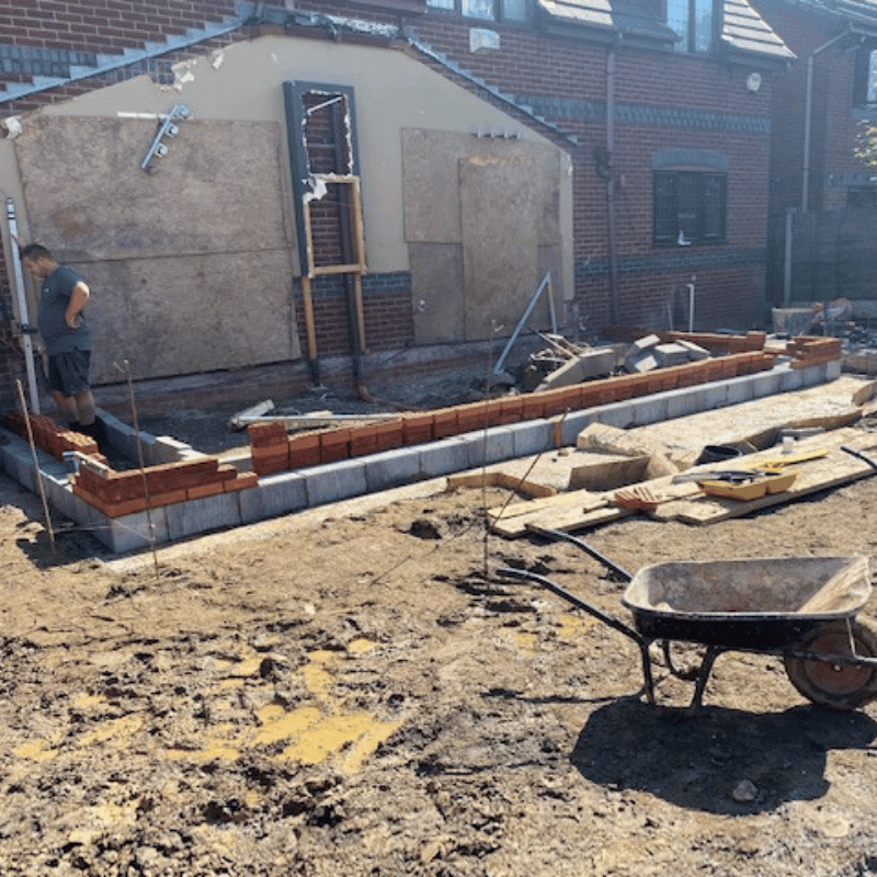 Worsley extension building site with foundations in and brickworks beginning